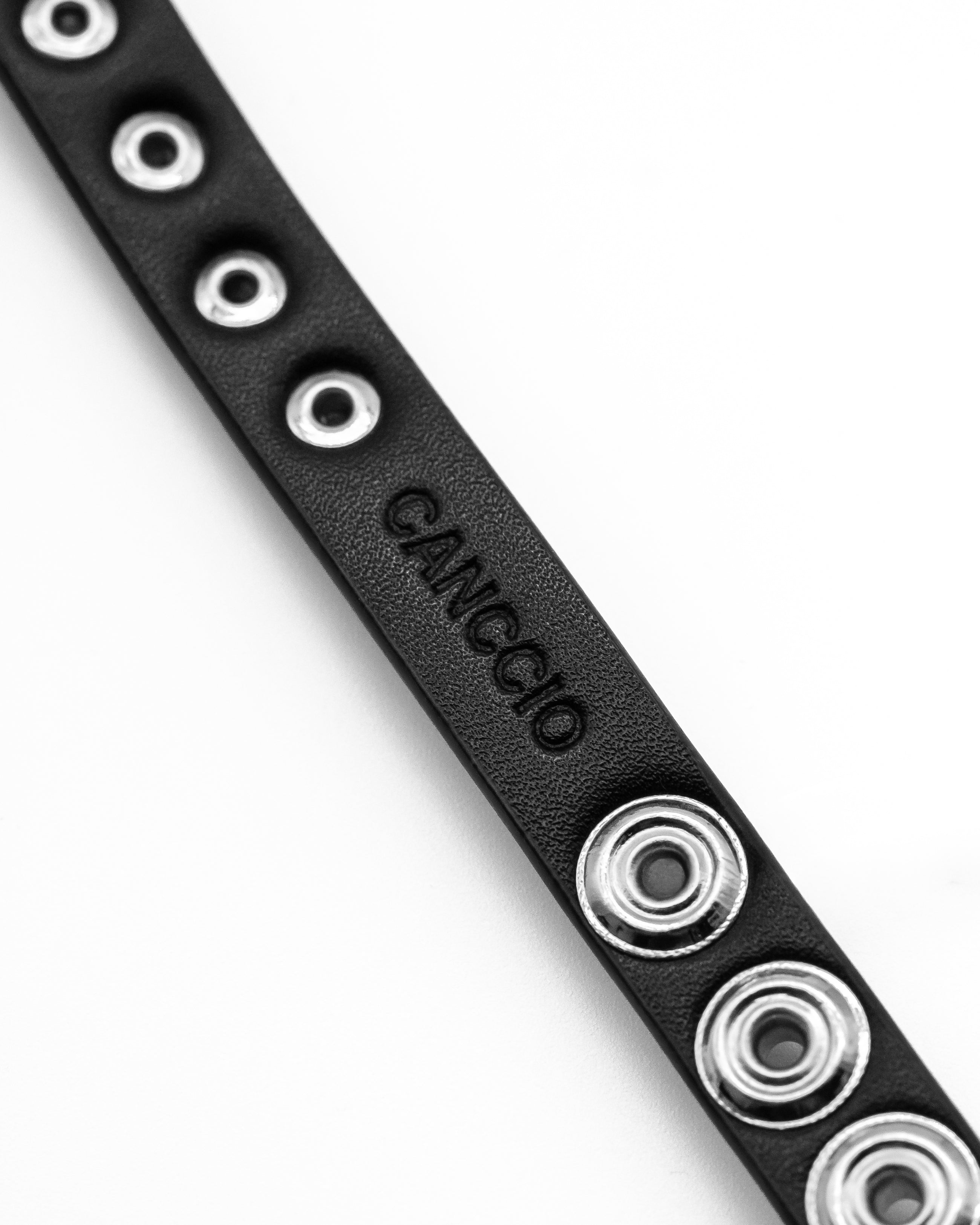 CANCCIO Hexagon black leather bracelet back view with adjustable sizing holes and debossed brand logo