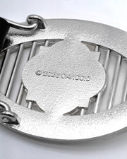 CANCCIO ORNA silver buckle close up with embossed branding engravement, texture backside close up